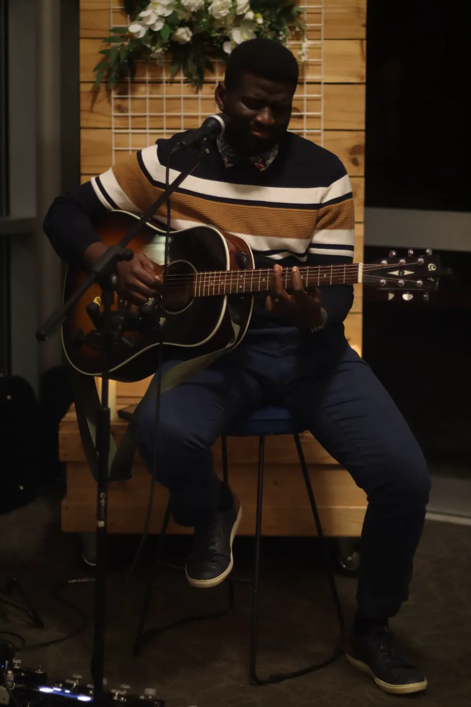 Acoustic guitar performance at a Nhom Lau gathering
